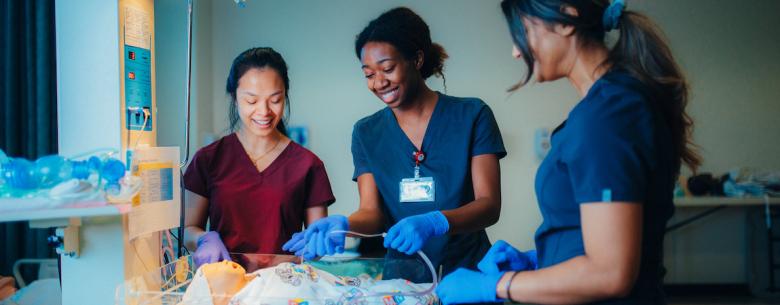 Roseman University College of Nursing students engaging in hands-on neonatal care